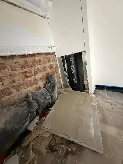 Sump pump and pit in a Buffalo basement